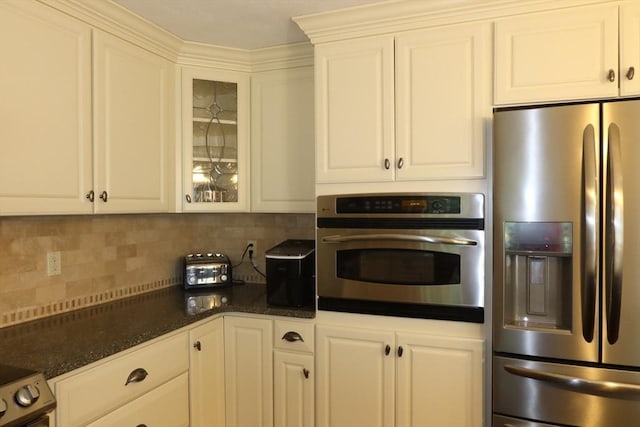 12 Hampton Ct, Walpole, MA 02032 - kitchen with appliances with stainless steel finishes, tasteful backsplash, white cabinetry, and glass insert cabinets