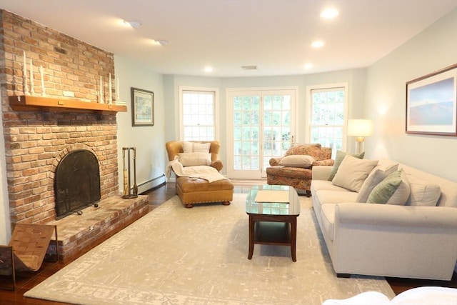 12 Hampton Ct, Walpole, MA 02032 - living room with a baseboard heating unit, a fireplace, recessed lighting, and wood finished floors