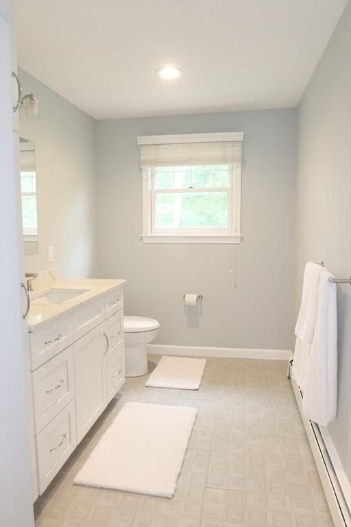 12 Hampton Ct, Walpole, MA 02032 - bathroom featuring healthy amount of natural light, vanity, a baseboard heating unit, toilet, and recessed lighting