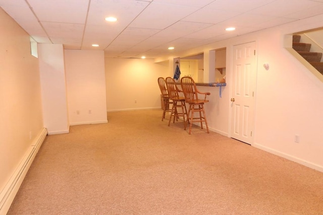 12 Hampton Ct, Walpole, MA 02032 - finished basement featuring a baseboard radiator, light carpet, recessed lighting, stairs, and baseboards