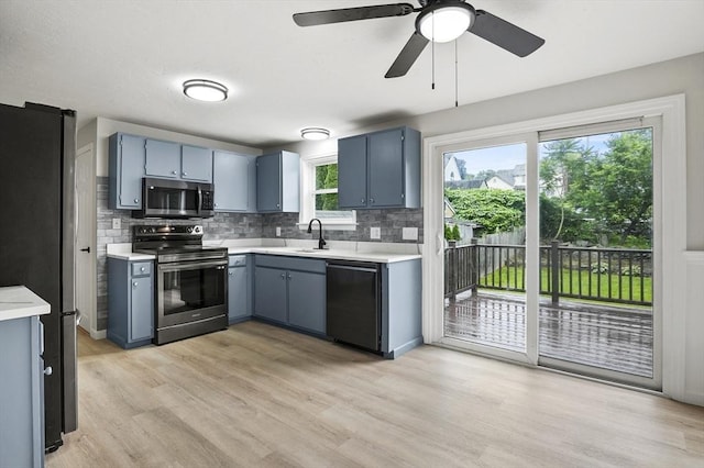 18 Nanita St, Worcester, MA 01604 - kitchen with appliances with stainless steel finishes, light countertops, and tasteful backsplash