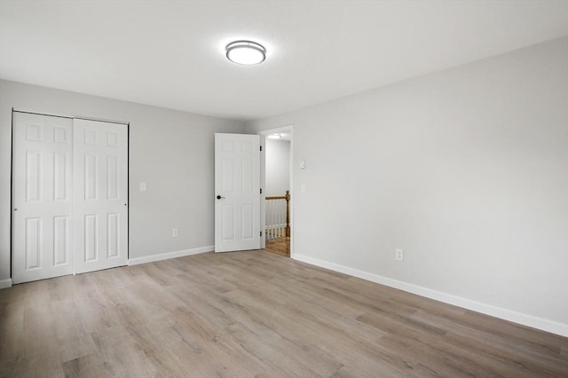 18 Nanita St, Worcester, MA 01604 - unfurnished bedroom featuring wood finished floors and a closet
