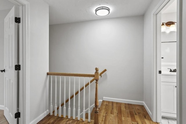 18 Nanita St, Worcester, MA 01604 - hallway featuring light wood-type flooring and an upstairs landing