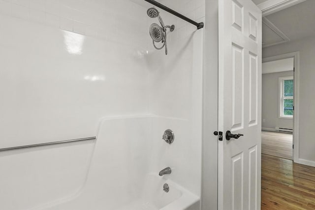 18 Nanita St, Worcester, MA 01604 - full bathroom with a baseboard heating unit, wood finished floors, and shower / washtub combination