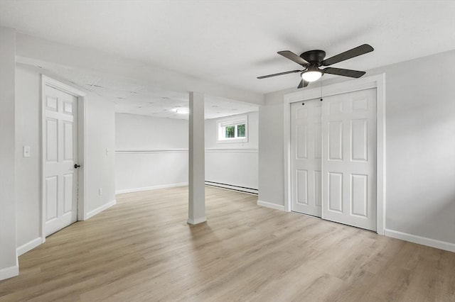 18 Nanita St, Worcester, MA 01604 - basement with a baseboard radiator, light wood-type flooring, and ceiling fan
