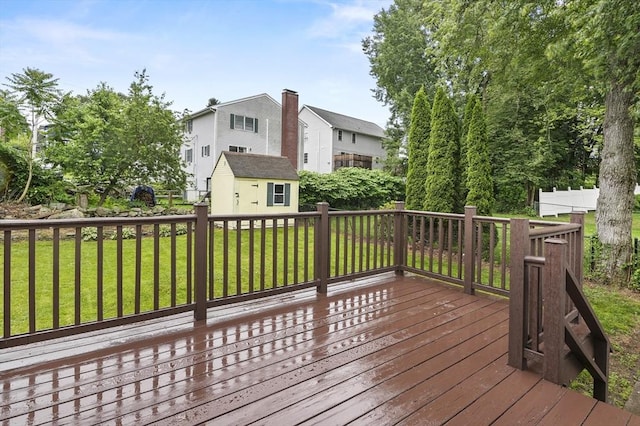 18 Nanita St, Worcester, MA 01604 - wooden terrace with a lawn, a storage unit, and a residential view