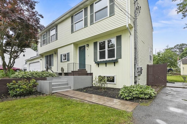 18 Nanita St, Worcester, MA 01604 - colonial-style house with a front yard and a garage