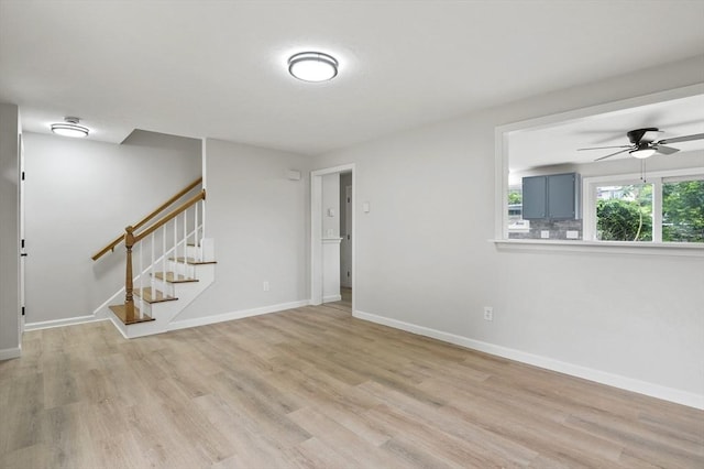 18 Nanita St, Worcester, MA 01604 - unfurnished room featuring light wood finished floors, stairway, and a ceiling fan