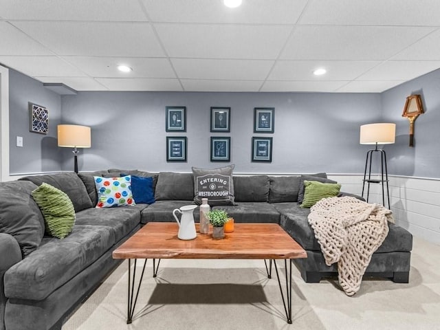 living room featuring carpet flooring, recessed lighting, and a paneled ceiling