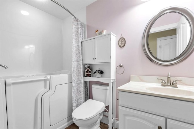 bathroom with vanity and toilet