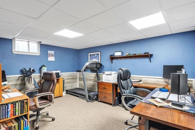 home office featuring wainscoting, a paneled ceiling, and light colored carpet