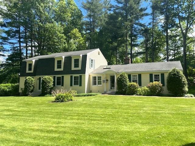 26 N Hill Rd, Westford, MA 01886 - colonial inspired home with a gambrel roof, a chimney, a front yard, and entry steps