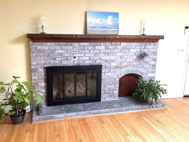 26 N Hill Rd, Westford, MA 01886 - detailed view of a brick fireplace and wood finished floors