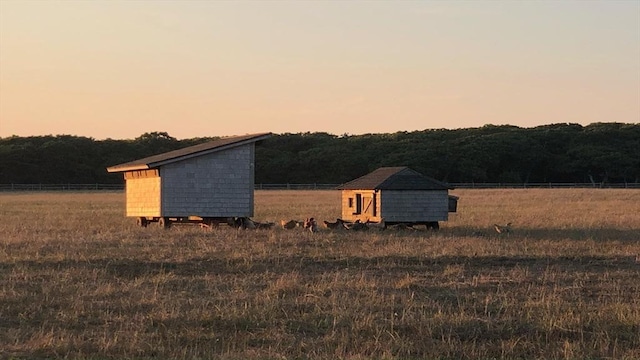 61 Butlers Cove Rd, Edgartown, MA 02539 - outdoor structure at dusk featuring a storage shed and a view of countryside