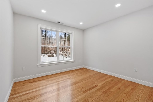 unfurnished room with light hardwood / wood-style floors