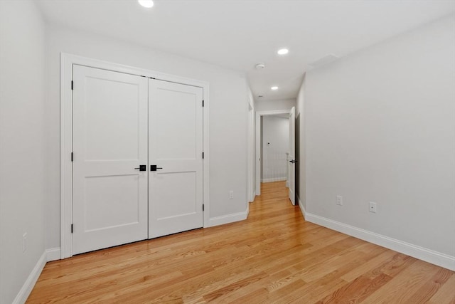 corridor featuring light hardwood / wood-style floors