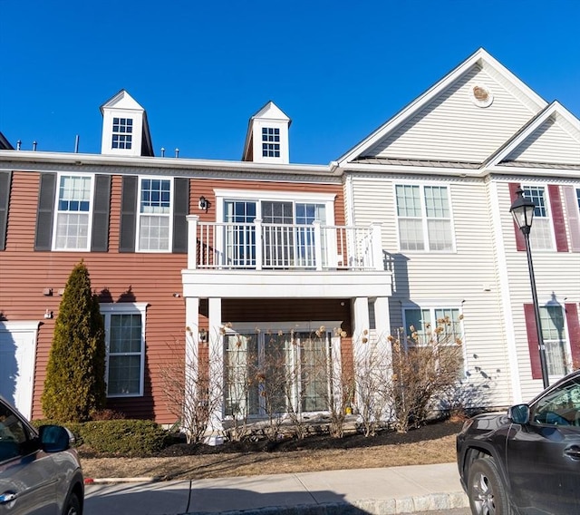 multi unit property featuring a balcony