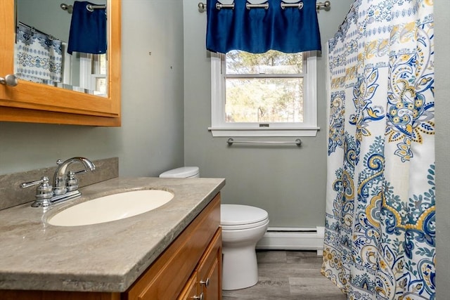 full bathroom featuring toilet, baseboard heating, vanity, wood finished floors, and a shower with curtain