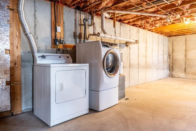 clothes washing area with laundry area and separate washer and dryer