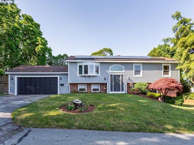 168 Varao Ave, Somerset, MA 02726 - bi-level home featuring a front yard, solar panels, driveway, and an attached garage