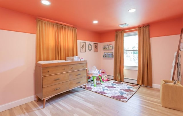 168 Varao Ave, Somerset, MA 02726 - playroom featuring light wood finished floors, recessed lighting, and a baseboard heating unit