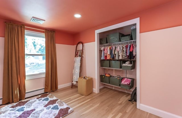 168 Varao Ave, Somerset, MA 02726 - bedroom with wood finished floors, recessed lighting, a closet, and baseboard heating