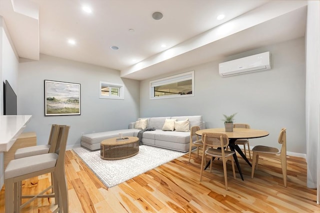 living room with wood-type flooring and a wall mounted AC