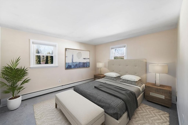 bedroom with light carpet and a baseboard heating unit