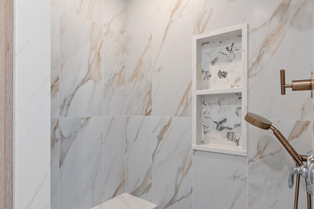 full bathroom featuring a marble finish shower