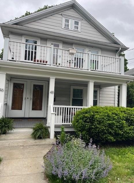 46 Unity Ave Unit 2, Belmont, MA 02478 - view of front of property featuring a balcony and covered porch