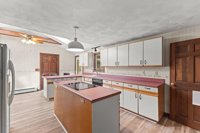 3 Meadow Way, Norton, MA 02766 - kitchen featuring black appliances, baseboard heating, a sink, lofted ceiling, and a peninsula