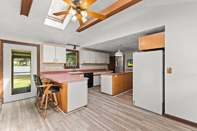 3 Meadow Way, Norton, MA 02766 - kitchen featuring freestanding refrigerator, a peninsula, a sink, healthy amount of natural light, and beam ceiling
