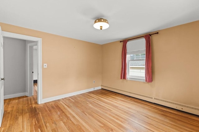 3 Meadow Way, Norton, MA 02766 - empty room featuring a baseboard heating unit, light wood-style flooring, and baseboards