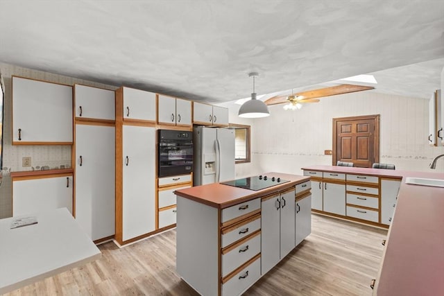 3 Meadow Way, Norton, MA 02766 - kitchen with black appliances, light wood-style flooring, a sink, a center island, and pendant lighting