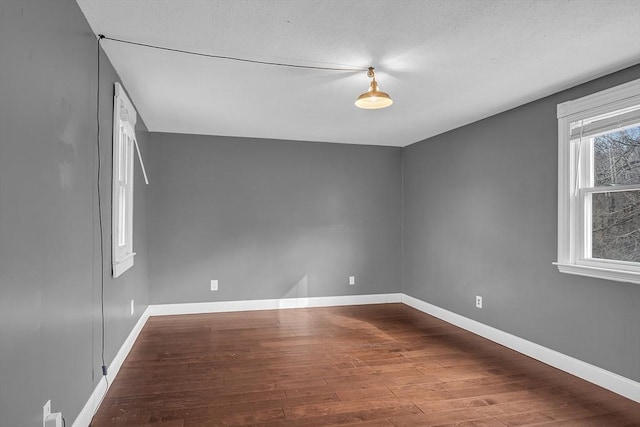 unfurnished room featuring hardwood / wood-style flooring