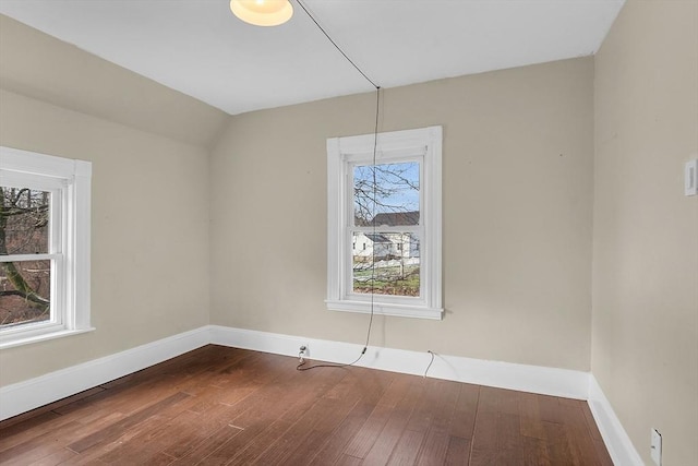 unfurnished room with hardwood / wood-style flooring and a wealth of natural light