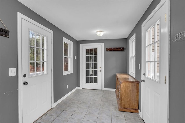 doorway to outside featuring light tile patterned floors