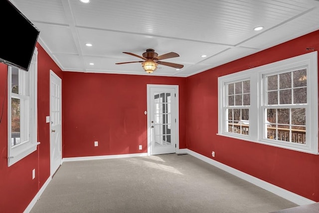 carpeted empty room featuring ceiling fan