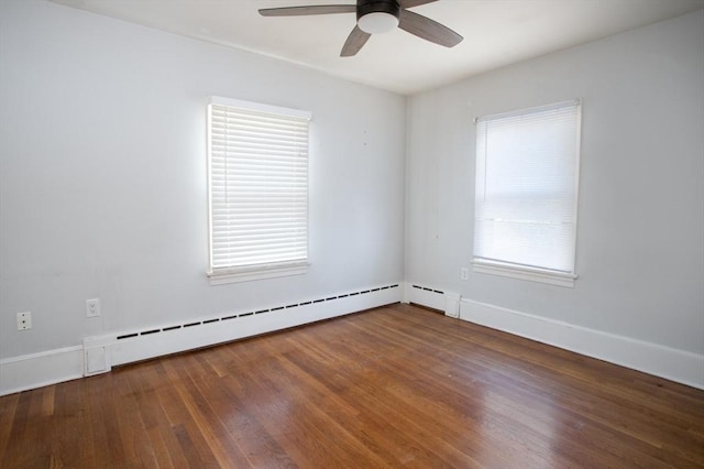 unfurnished room featuring wood-type flooring, a baseboard radiator, ceiling fan, and a healthy amount of sunlight