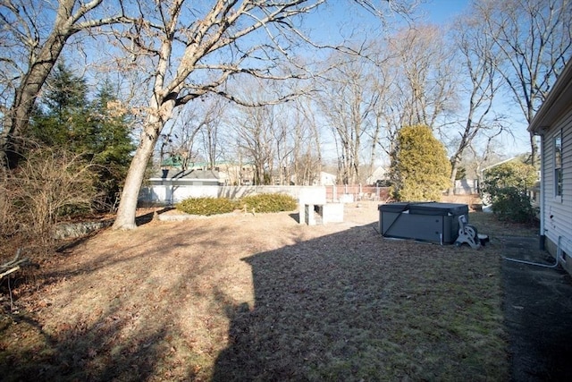 view of yard with a hot tub