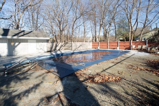 view of swimming pool with a patio