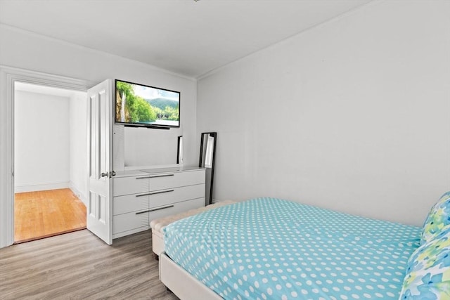 bedroom with light wood-style floors