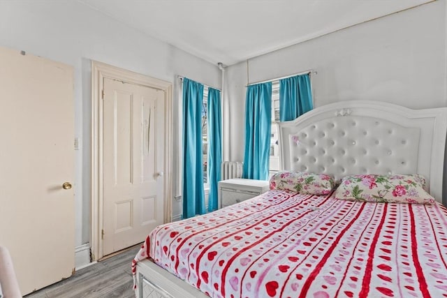 bedroom featuring light wood-style floors