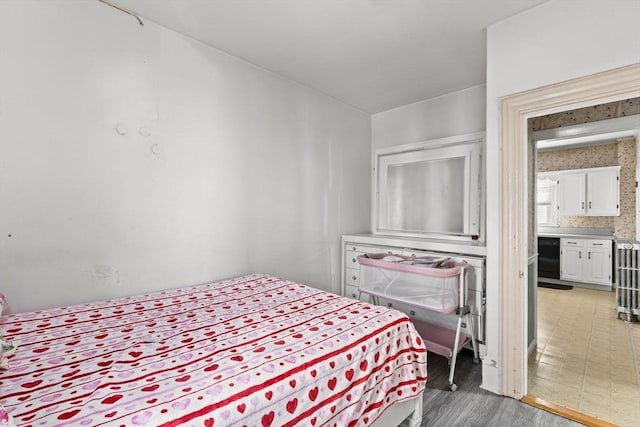 bedroom with light wood finished floors