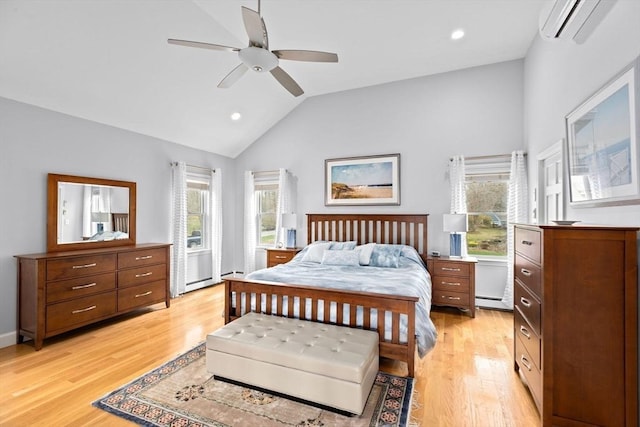 bedroom featuring an AC wall unit, lofted ceiling, light wood-style floors, and recessed lighting