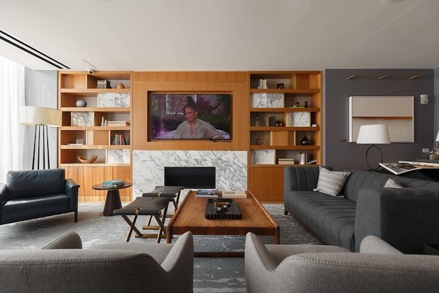 carpeted living room with built in shelves