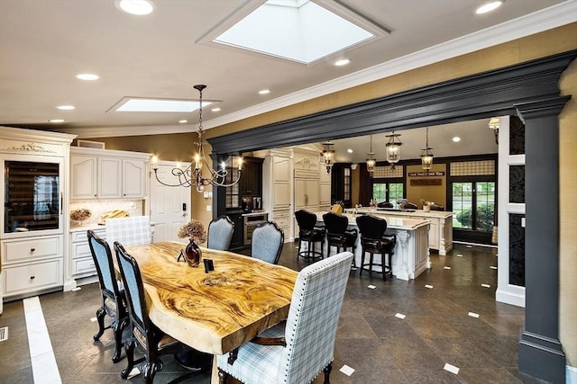 18 Connors Way, Leominster, MA 01453 - dining area featuring ornamental molding, a chandelier, wine cooler, and recessed lighting