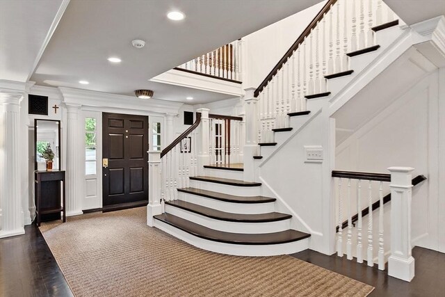 18 Connors Way, Leominster, MA 01453 - stairs with a decorative wall, wood finished floors, decorative columns, recessed lighting, and crown molding