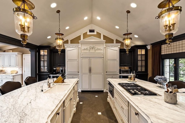 18 Connors Way, Leominster, MA 01453 - kitchen with stainless steel gas cooktop, a sink, crown molding, lofted ceiling, and a breakfast bar