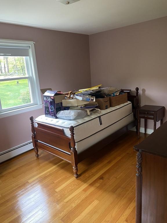 bedroom with light wood finished floors